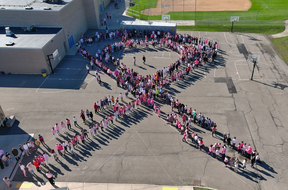MS Students and Staff Create Human Ribbon for Breast Cancer Awareness