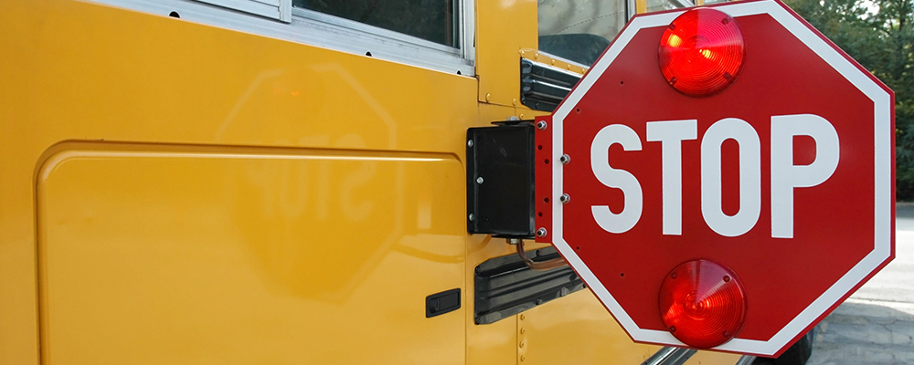 school bus with red stop sign