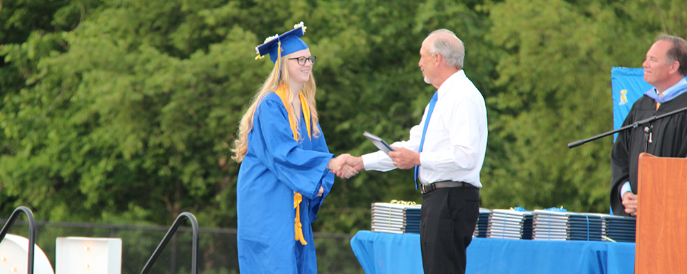 Girl receiving diploma